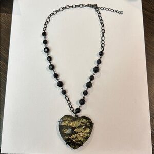 Black beaded necklace with a black lace heart pendant